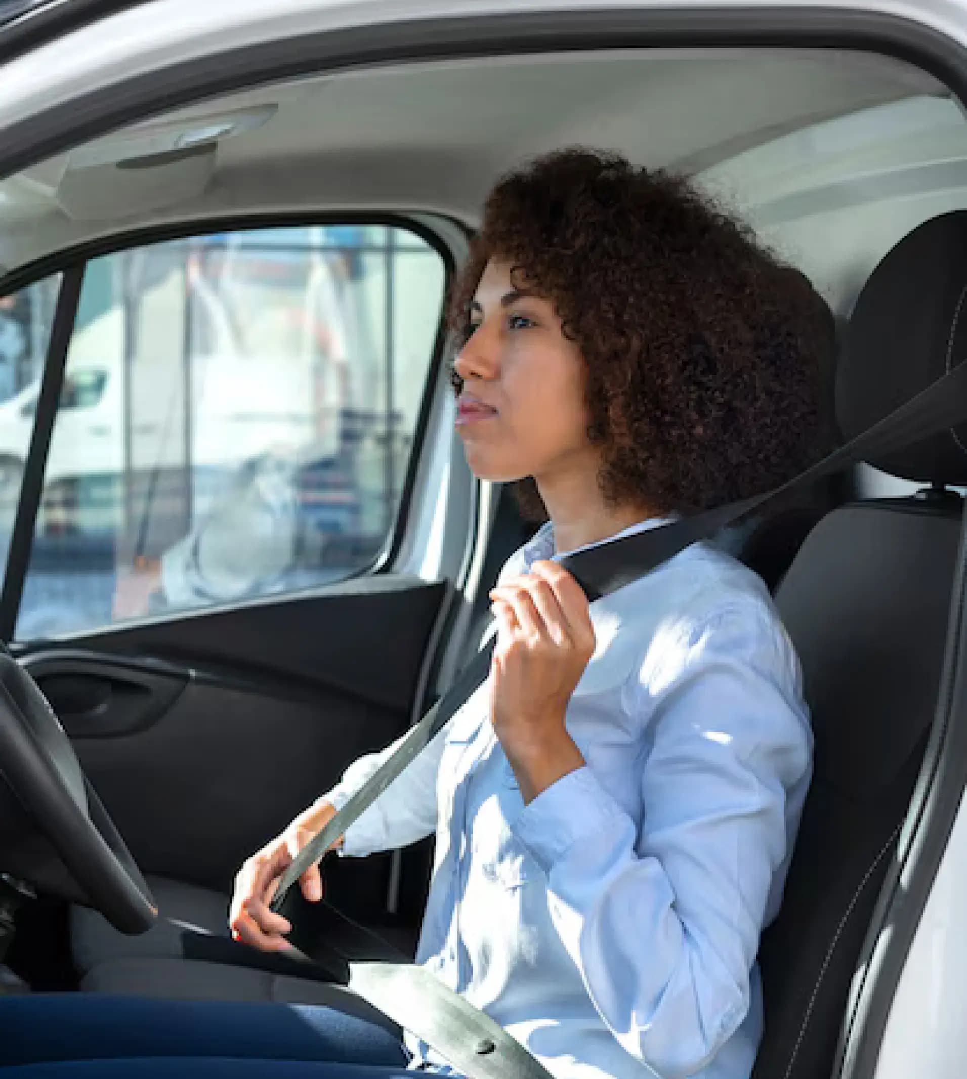 Female driver sitting comfortably in car